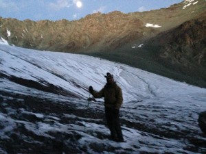 Just before crossing the glacier in moonlight, it is freezing cold. A sock monkey hat protects my ears.