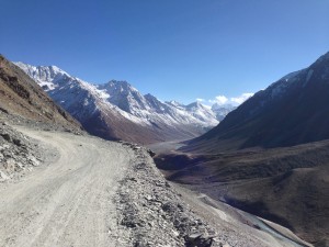 After Graphu but before the summit and chortens atop Kuunzum La (4551), some switchbacks that make me think I've started the climb and am looking back. From Gramphu along the Chenab River, then crossing to the its north side, the going got so tough I nearly cried as I straddle pushed the motorbike between frame outs atop boulders in steeply climbing, running water covered 'path'. I understood why two people had advised me not to come this way,  that they had heard the road was in really bad condition (even by indian mountain standards!).