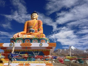 The modern, big bright Budda at Kibber sits on a hill overlooking the valley and Spiti far beyond and even below, likely facing west.