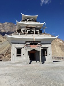 What will house the remains of the mummified monk once it is completed. Currently, a small structure nearby which locked (a village woman working with the road crew has the key) and inside is the mummy within a glass case.