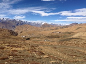 The village of Komic, to the right, and Hikkim to the left. Further left, a gorge that takes the breath away begins to open up to the Spiti and Kaza nearly directly below; the road continues along the high sides with the occasional turret of mountain mixed in with the occasional absence (and thus stacked stones) of mountain.