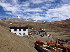 Kibber, about 20 km north of kaza on the east side of the Spiti River. The towering Shilla in the background, a 7027m peak in the Kibber Wildlife Sanctuary. Motoring down into the town, I become nearly stuck and burn a lot of clutch getting up, even on the load-free bike; a young man watches, and I kinda wave, embarrassed.