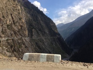 Towards Chitkul that marks the end of this road running away from the Hindustan-Tibetian Highway, and the end of India with Chinese boarder less than 30 km due west. Due south, the INdian state of Uttarakhand. India maintains a military presence in the area, including within the gorgeous conifer thick wildlife refuge. The Garhwal Himalayas start here also, running south east and falling largely within Uttarakhand (per wikipedia). 