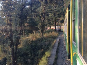 A man stands alongside the tracks.